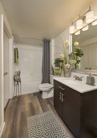 a kitchen with stainless steel appliances a refrigerator and a stove top oven