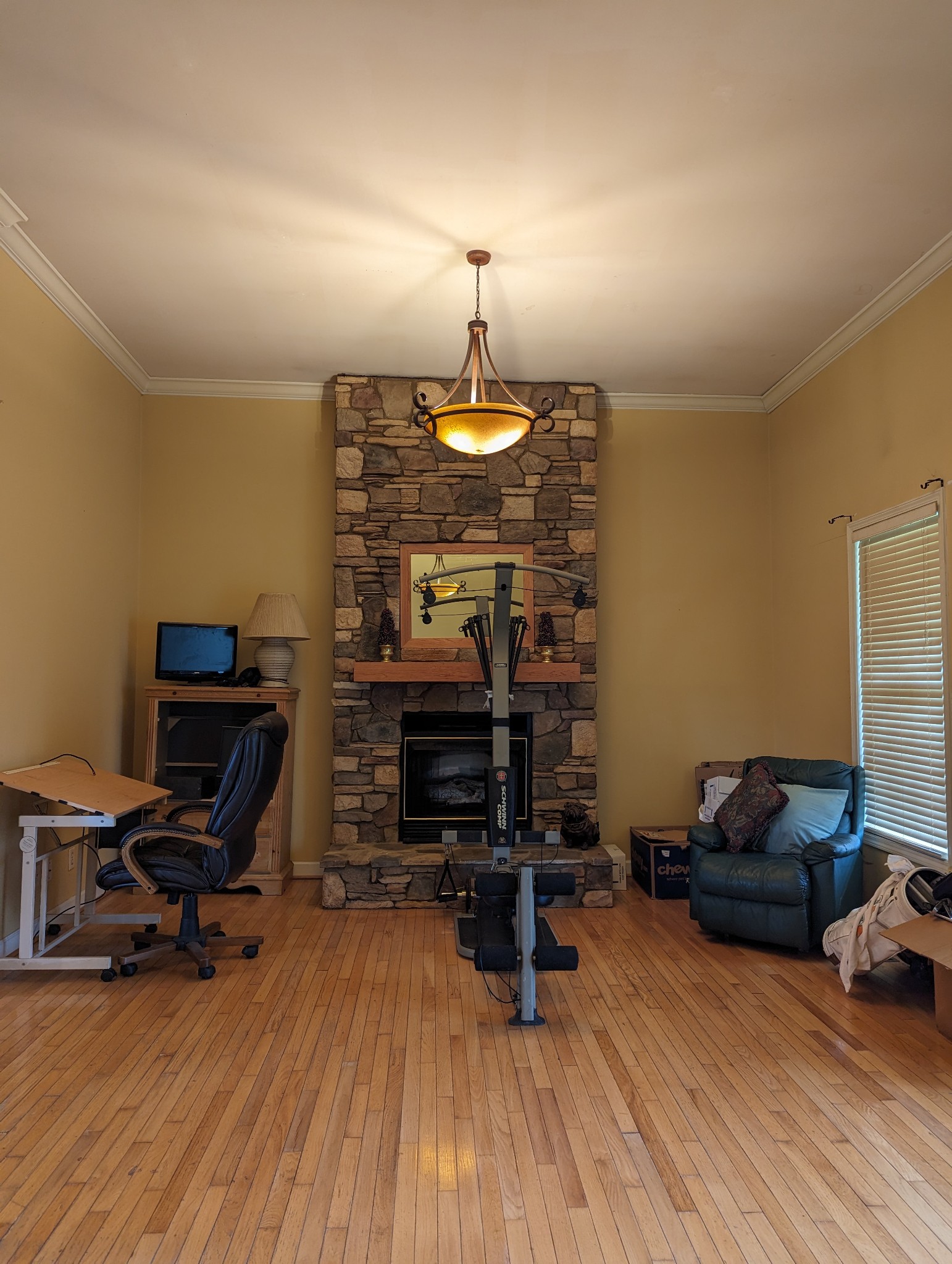 13702 Versailles Road Rockvale, TN 37153 - Photo 8 of 17 Floor to ceiling propane fireplace in this 29x24 room that is ready for a makeover.