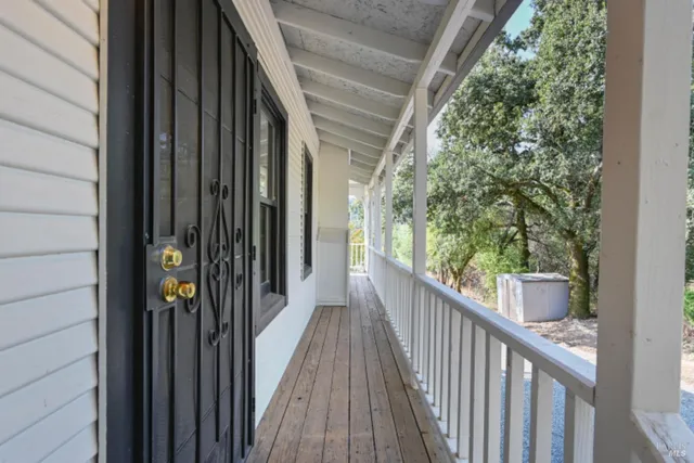 a bathroom with a granite countertop sink mirror vanity bathtub and toilet