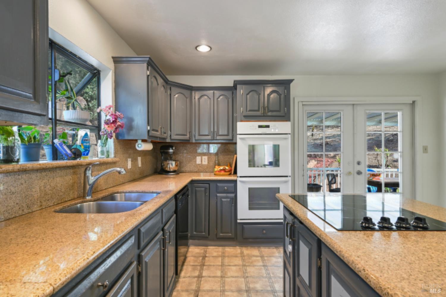 31258 Highway 128 Cloverdale, CA 95425 - Photo 23 of 88 a kitchen with stainless steel appliances granite countertop a sink stove and cabinets
