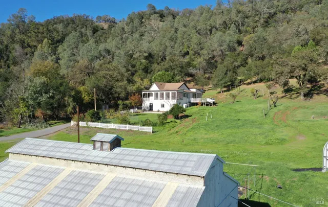 a view of a lake with a car parked in front of it