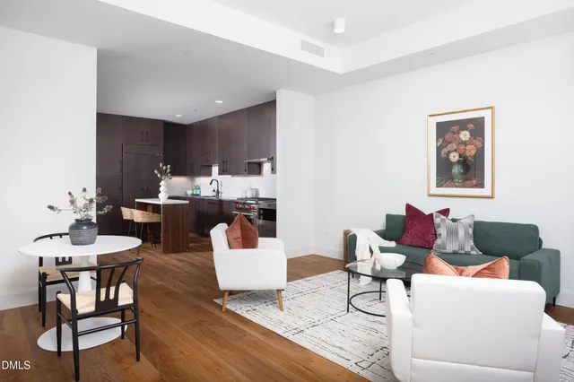 a living room with furniture and a table