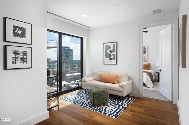 a living room with furniture and a gate