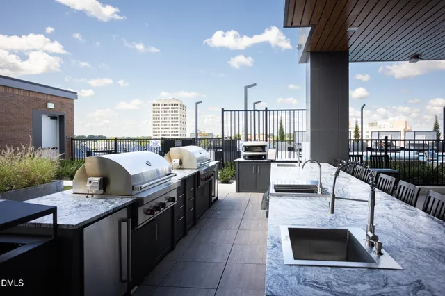 a view of a patio with couches chairs and a yard