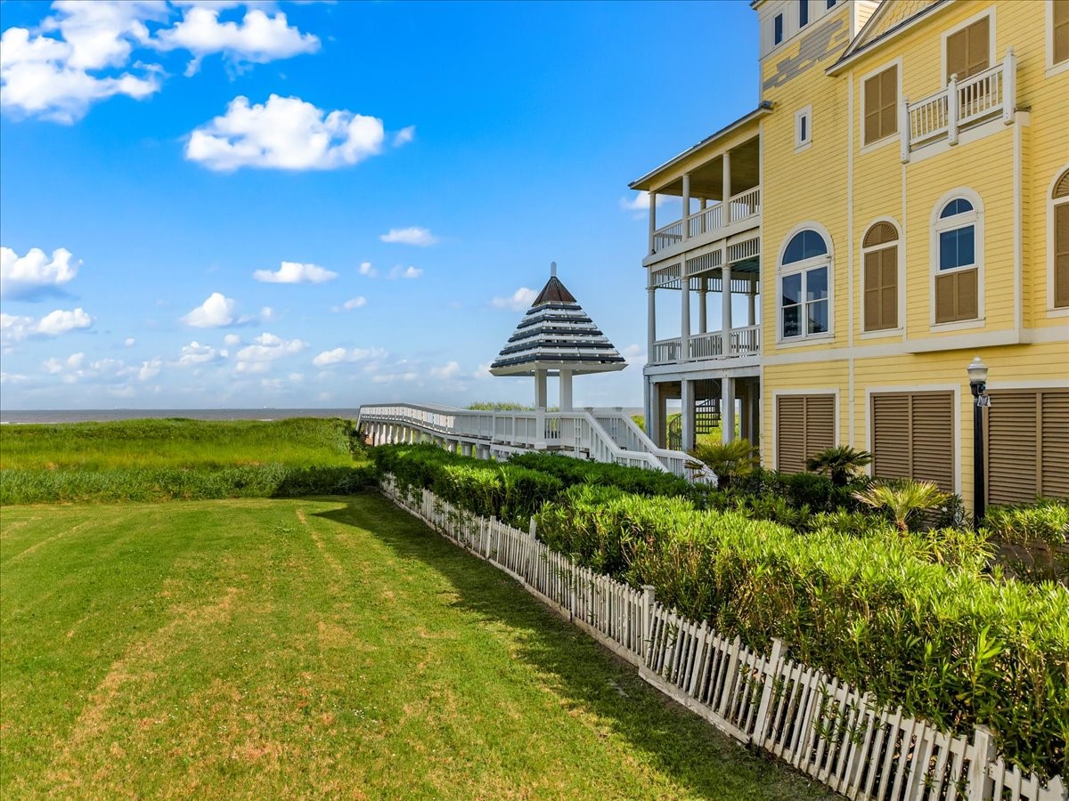726 Positano Road Galveston, TX 77550 - Photo 17 of 20 a front view of a house with a yard