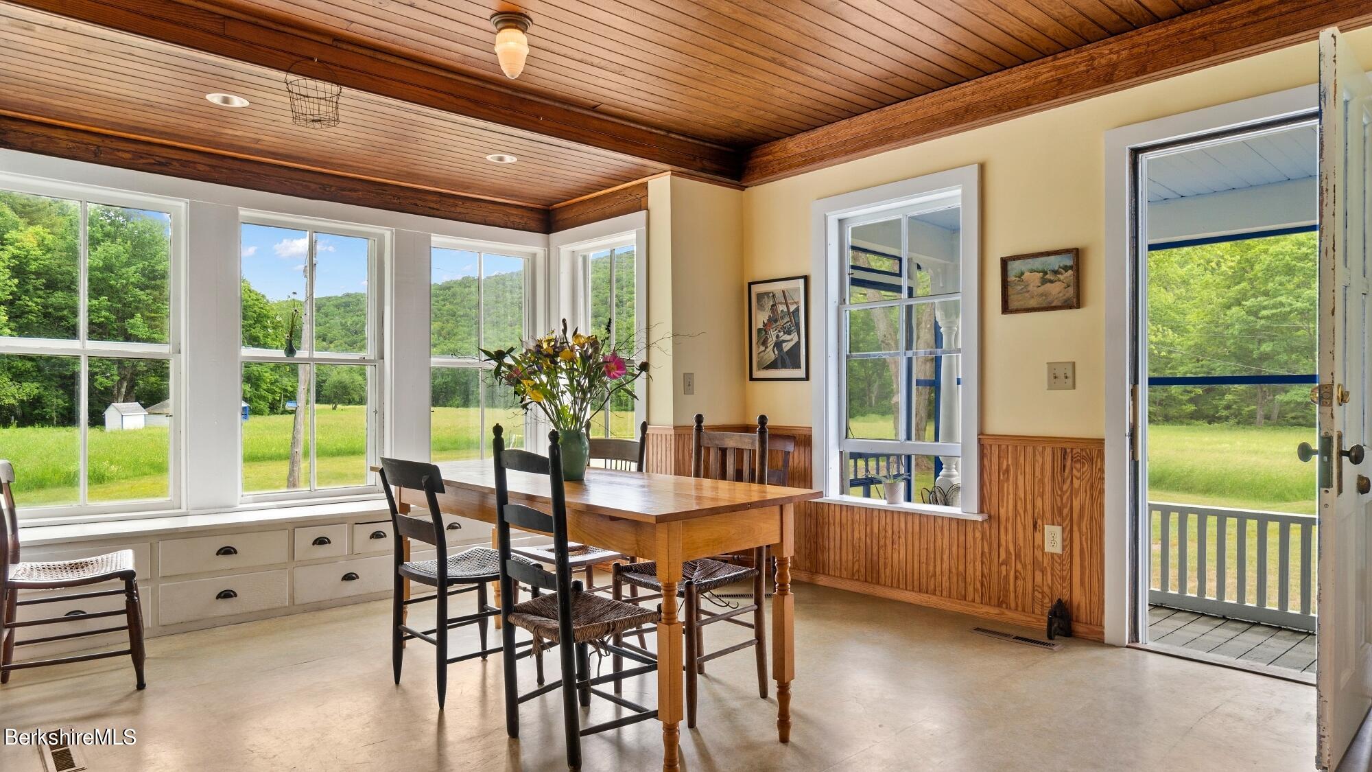601 East River Road Chester, MA 01050 - Photo 14 of 49 a dining room with furniture window and wooden floor
