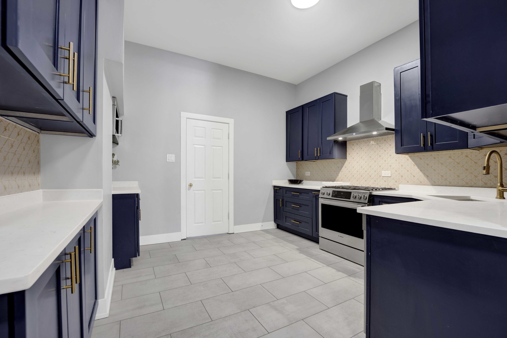 3806 South Indiana Avenue Chicago, IL 60653 - Photo 11 of 35 a kitchen with stainless steel appliances granite countertop a stove a sink and a refrigerator