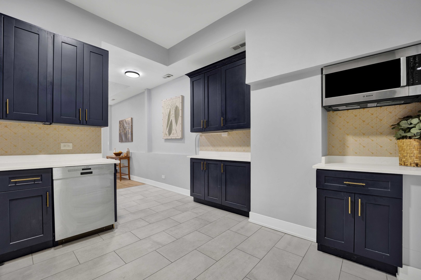 3806 South Indiana Avenue Chicago, IL 60653 - Photo 13 of 35 a kitchen with stainless steel appliances granite countertop a stove and a microwave oven