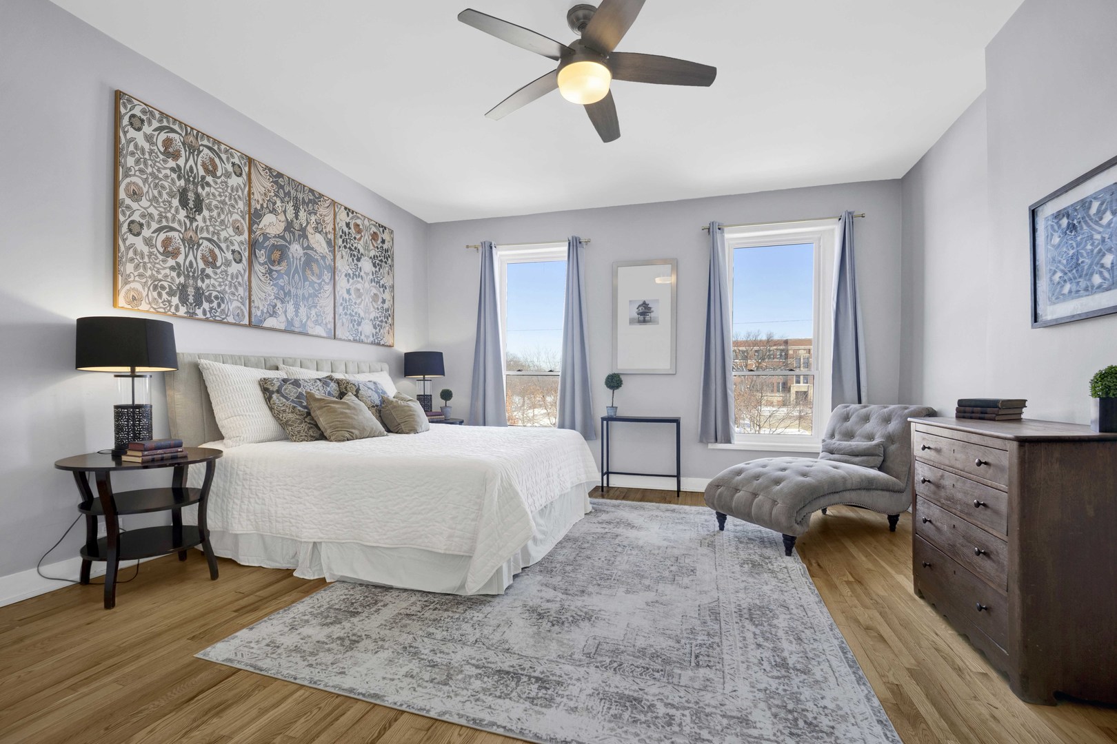 3806 South Indiana Avenue Chicago, IL 60653 - Photo 17 of 35 a spacious bedroom with a bed and wooden floor
