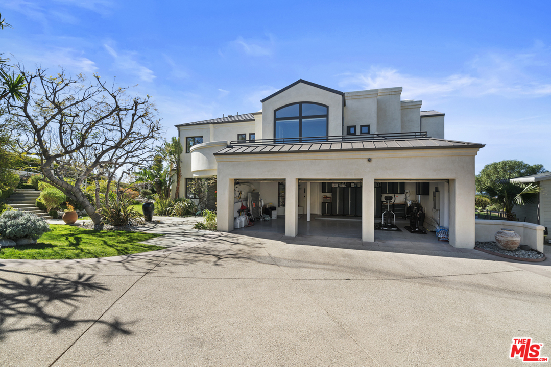 6165 Zumirez Drive Malibu, CA 90265 - Photo 29 of 33 a view of a house with a outdoor space