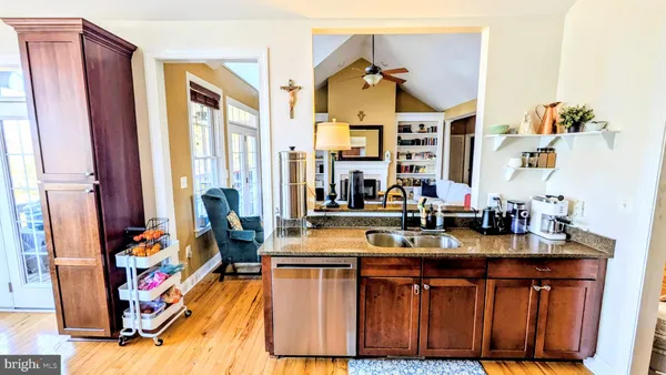 a kitchen with a refrigerator and a stove top oven