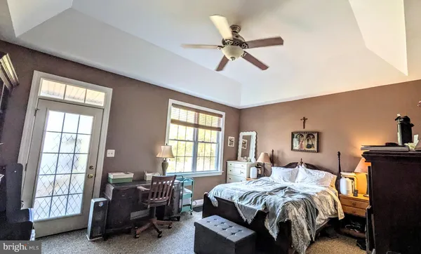 a bedroom with furniture and a window
