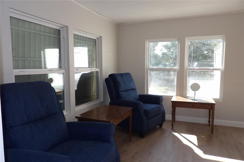6608 Roosevelt Drive Port Richey, FL 34668 - Photo 11 of 39 a living room with furniture and a window