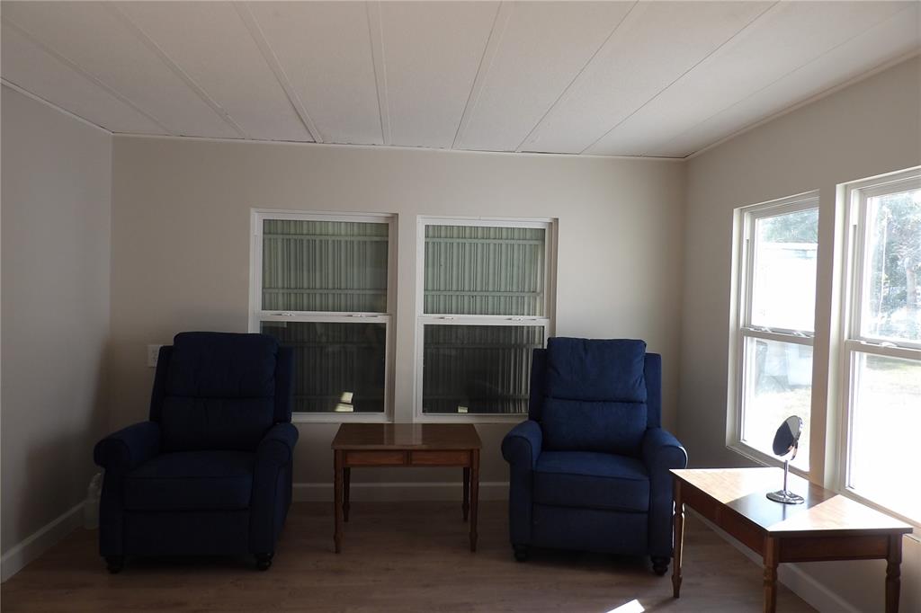 6608 Roosevelt Drive Port Richey, FL 34668 - Photo 12 of 39 a living room with furniture and a window