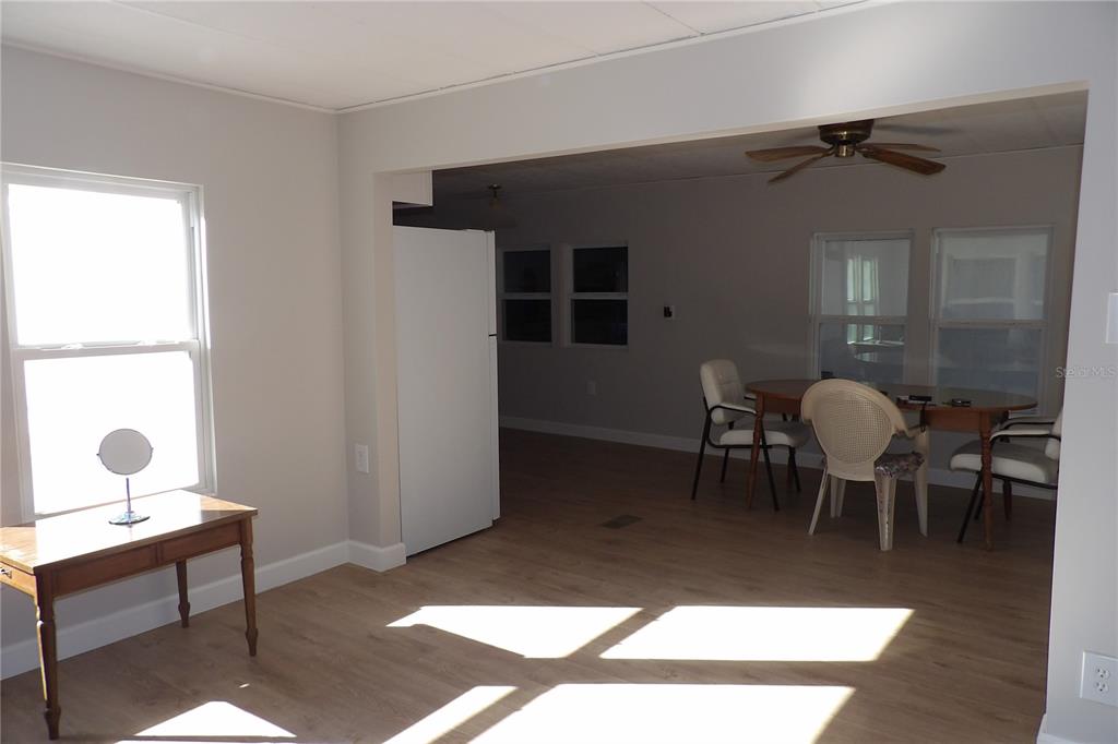 6608 Roosevelt Drive Port Richey, FL 34668 - Photo 13 of 39 a living room with chairs and a table