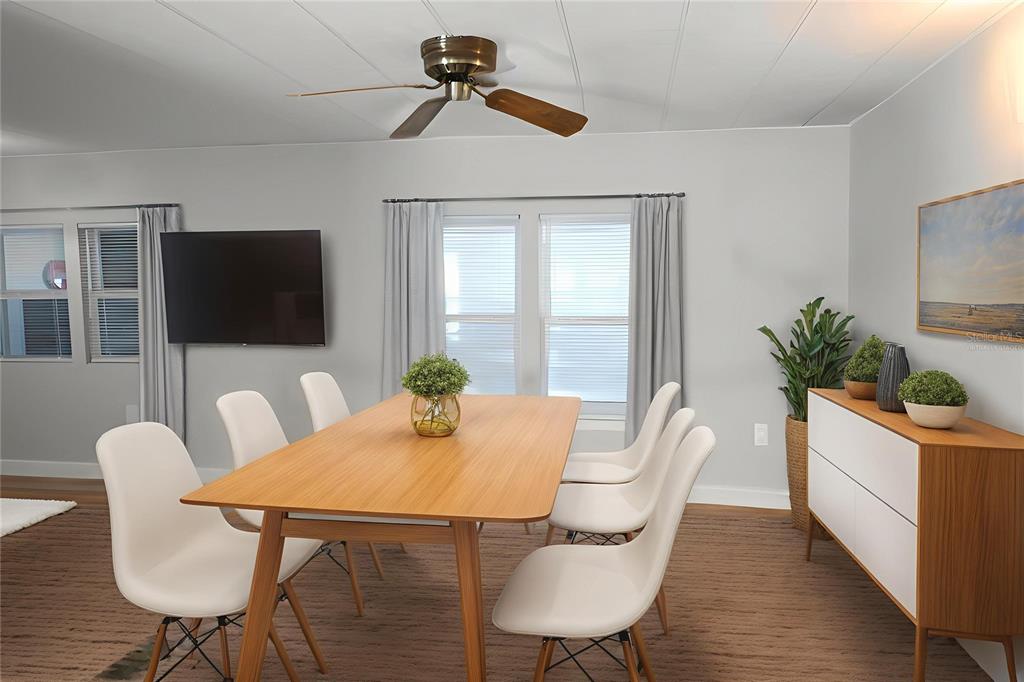 6608 Roosevelt Drive Port Richey, FL 34668 - Photo 14 of 39 a view of a dining room with furniture window and wooden floor