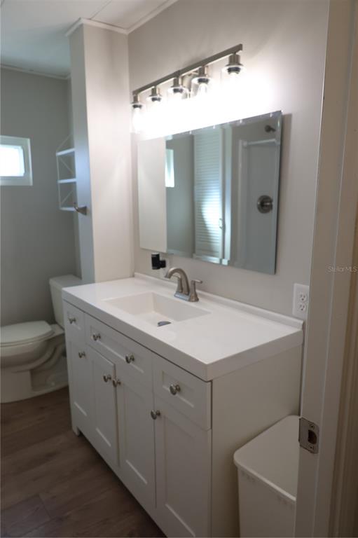 6608 Roosevelt Drive Port Richey, FL 34668 - Photo 26 of 39 a bathroom with a sink and a mirror