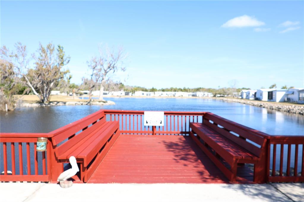 6608 Roosevelt Drive Port Richey, FL 34668 - Photo 4 of 39 a balcony with outdoor seating and city view