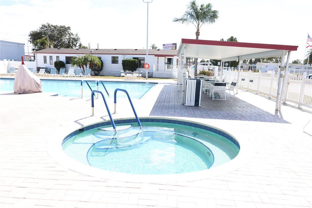 6608 Roosevelt Drive Port Richey, FL 34668 - Photo 6 of 39 a view of a swimming pool with outdoor seating