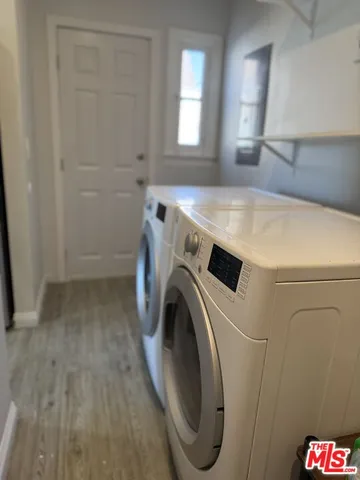 a view of a storage & utility room with washer and dryer