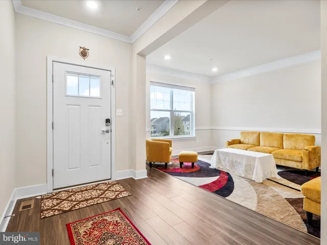 a bedroom with two beds and a couch