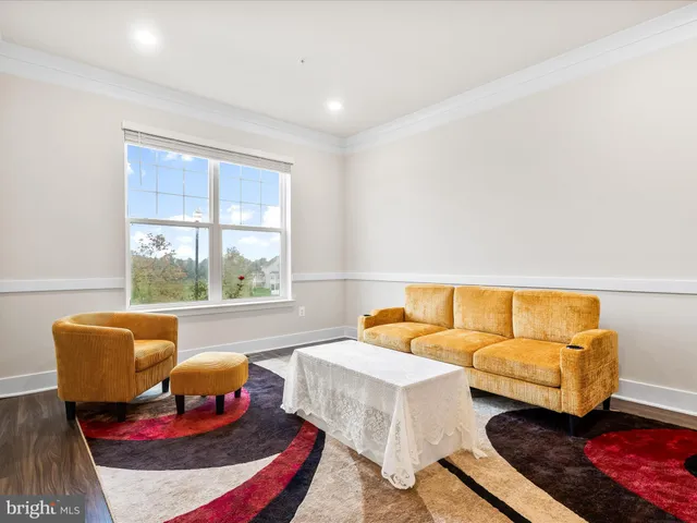 a bedroom with two beds and a large window