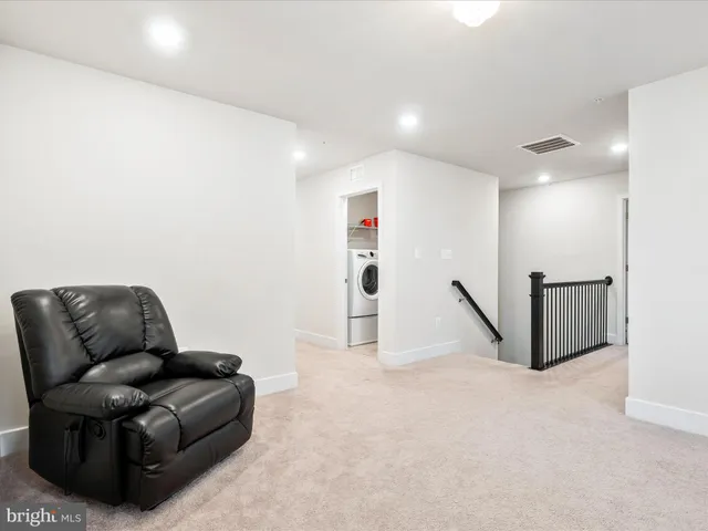 a bedroom with a large bed and a couch