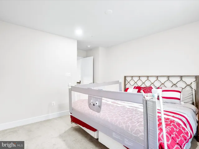 a bedroom with a bed and a closet