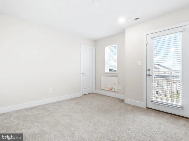a bathroom with a sink a toilet a mirror and shower