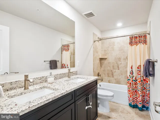 a room with furniture pool table gym equipment and a window