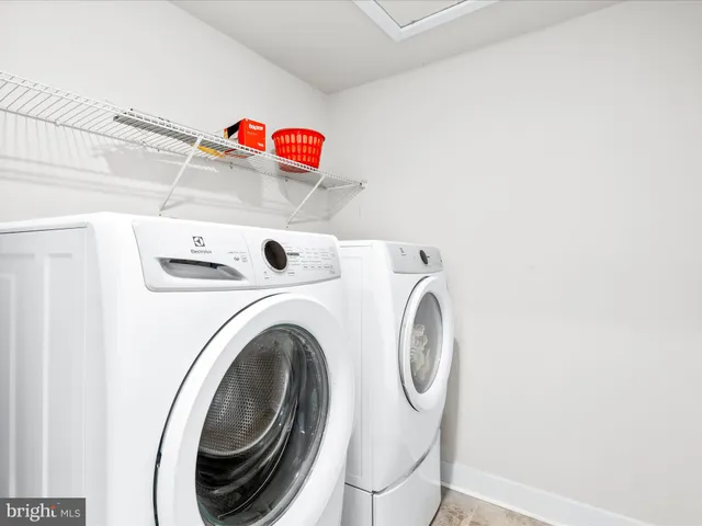 a view of a kitchen with furniture and an empty room