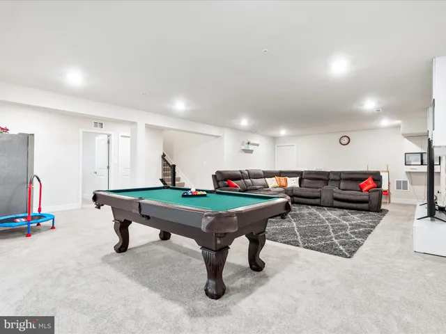 a open kitchen with stainless steel appliances granite countertop a stove a sink and a wooden cabinets