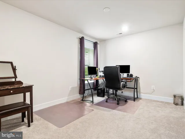 an aerial view of a house with a garden and lake view