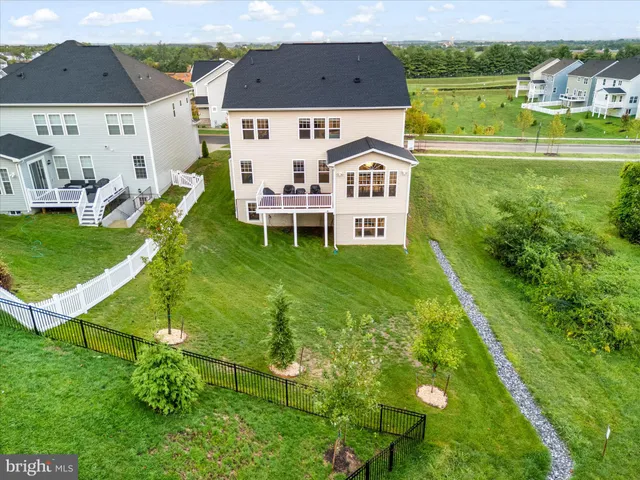an aerial view of a house with a garden