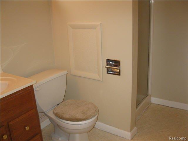 18730 Middlebelt Road Romulus, MI 48174 - Photo 12 of 15 ¾ bath with a walk-in shower and