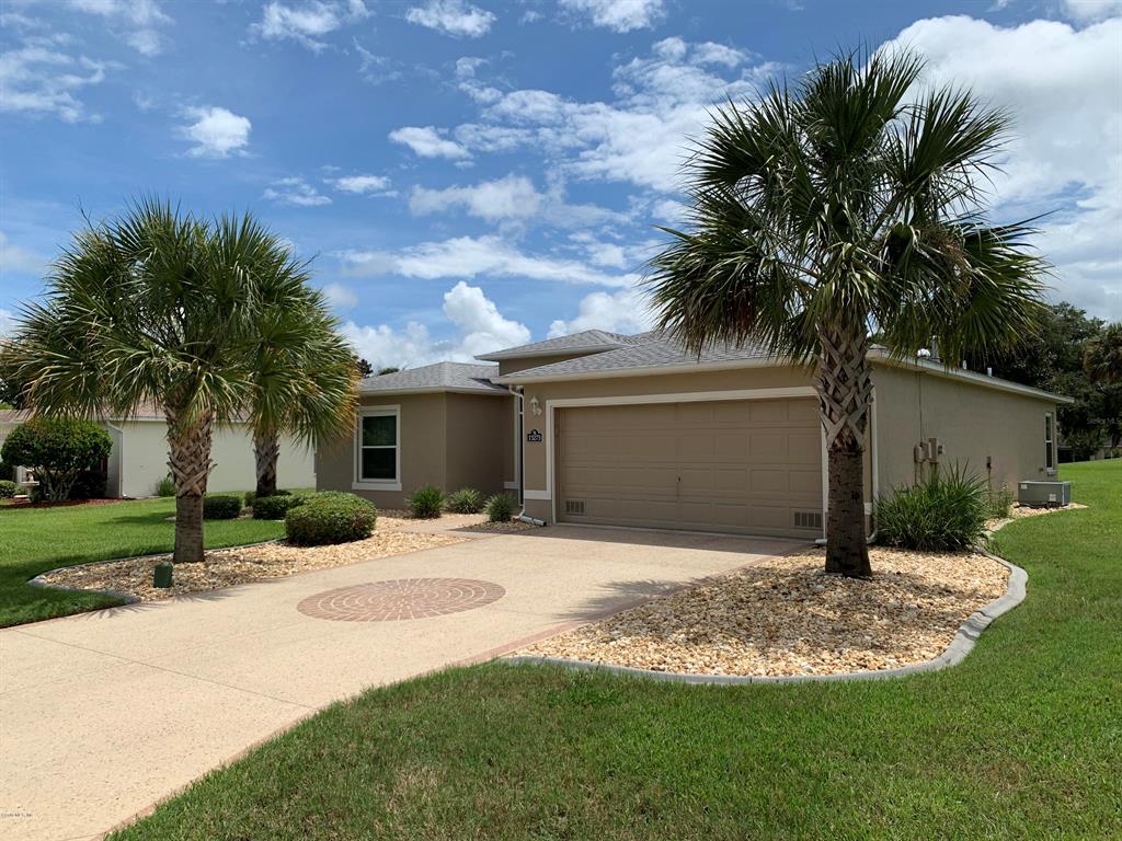 15275 Southwest 15th Terrace Road Ocala, FL 34473 - Photo 1 of 1 a front view of house with yard and green space