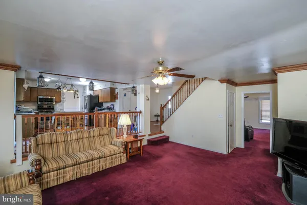 a room with pool table and windows