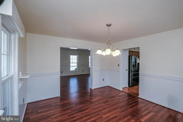 a kitchen with stainless steel appliances a stove refrigerator sink and microwave