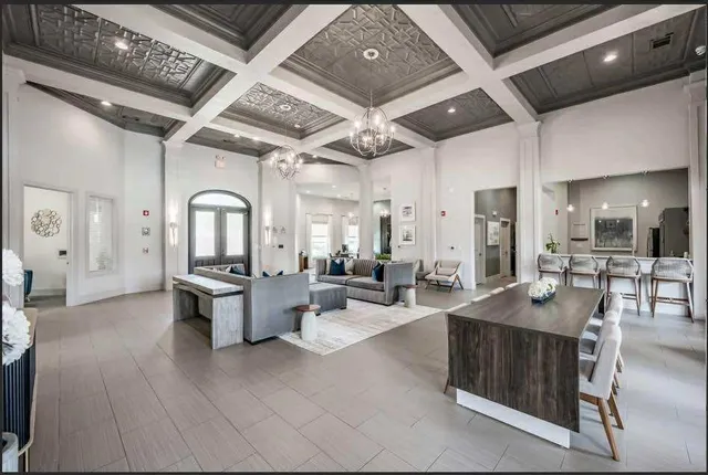 a large room with lots of counter space and windows