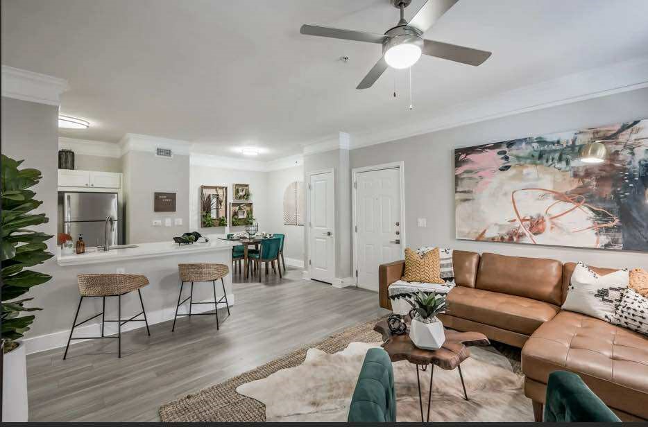 529 Barker-Clodine Road, Unit CYPRESS Houston, TX 77094 - Photo 19 of 21 a living room with furniture and wooden floor