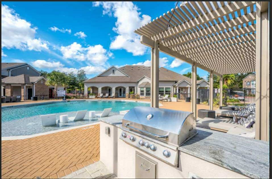 529 Barker-Clodine Road, Unit CYPRESS Houston, TX 77094 - Photo 3 of 21 a view of a house with backyard and sitting area