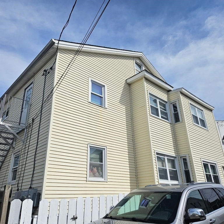 22 Sachem Street Fall River, MA 02724 - Photo 3 of 11 a view of a house with a car parked