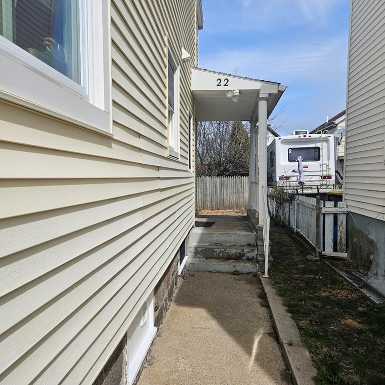 22 Sachem Street Fall River, MA 02724 - Photo 4 of 11 a view of a porch with wooden floor and roof