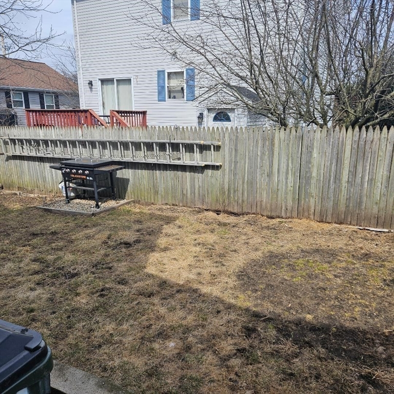 22 Sachem Street Fall River, MA 02724 - Photo 6 of 11 a view of a house with a wooden fence