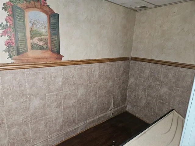 a view of wooden floor in a bathroom