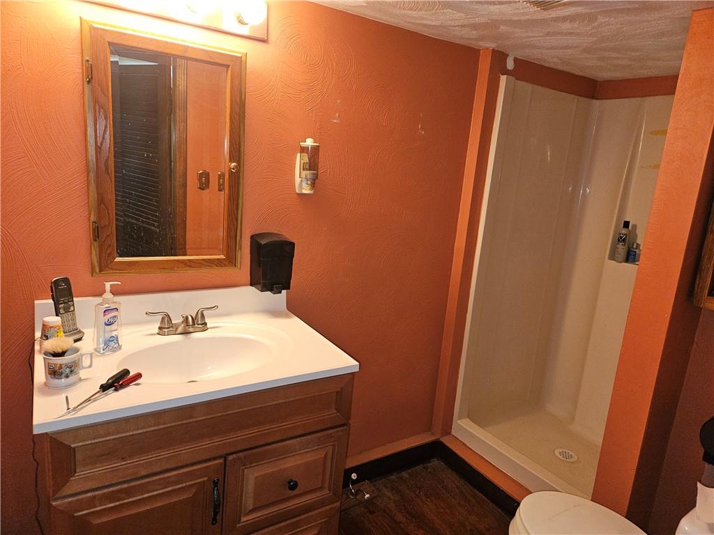 2215 Ardmore Boulevard, Unit 1 Forest Hills, PA 15221 - Photo 10 of 11 a bathroom with a sink and a mirror