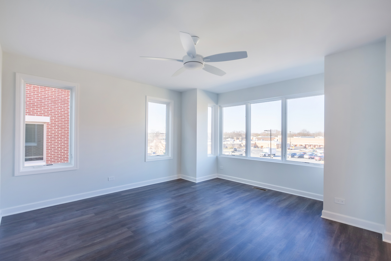 1239 Shermer Road Northbrook, IL 60062 - Photo 12 of 25 a view of an empty room with wooden floor and a window