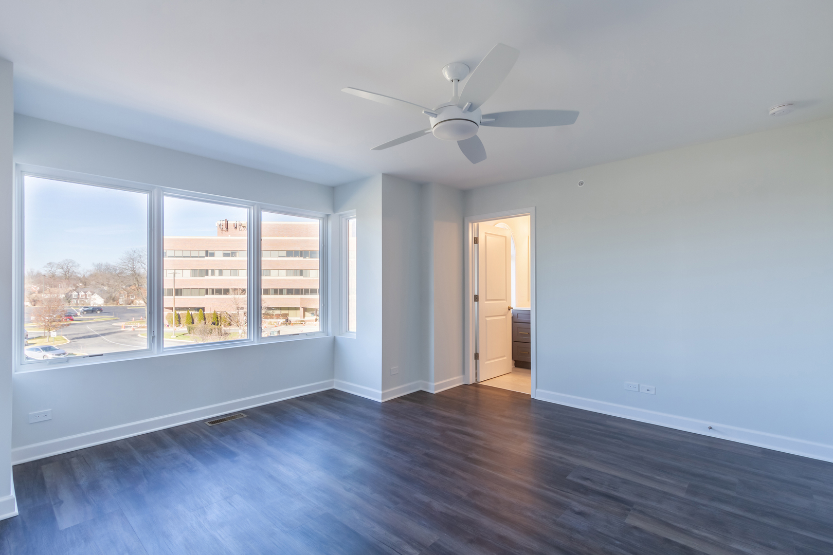 1239 Shermer Road Northbrook, IL 60062 - Photo 13 of 25 a view of an empty room with wooden floor and a window