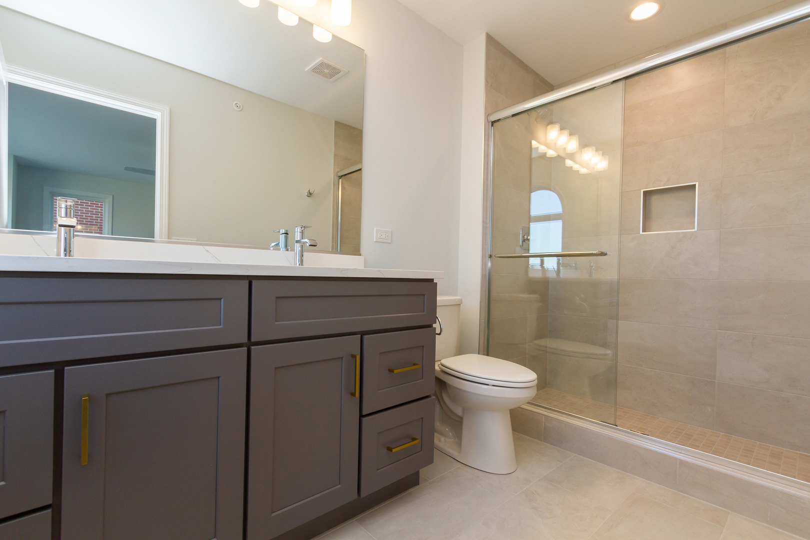 1239 Shermer Road Northbrook, IL 60062 - Photo 14 of 25 a bathroom with a sink a toilet and a mirror