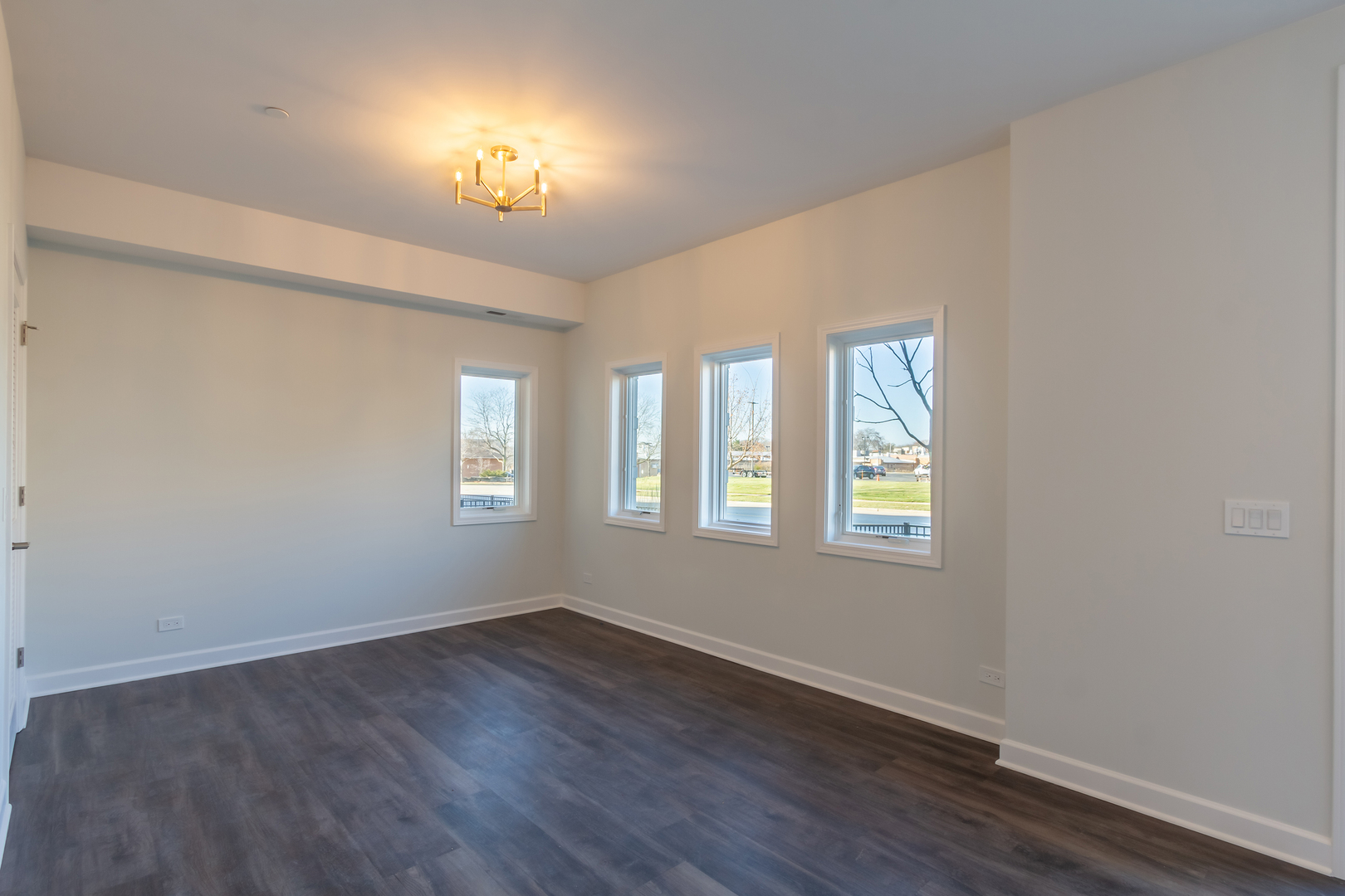 1239 Shermer Road Northbrook, IL 60062 - Photo 19 of 25 an empty room with wooden floor and windows